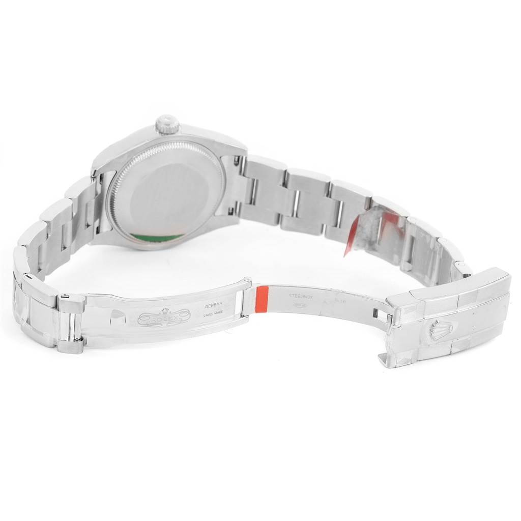 The image shows the open clasp and back side of a Mid-Size Rolex watch.