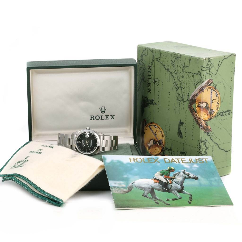 The Rolex Mid-Size 78240 Women's Stainless Steel Black Dial 78240 Women's Stainless Steel Black Dial model watch is presented in its case, along with the packaging box, a cleaning cloth, and a manual.