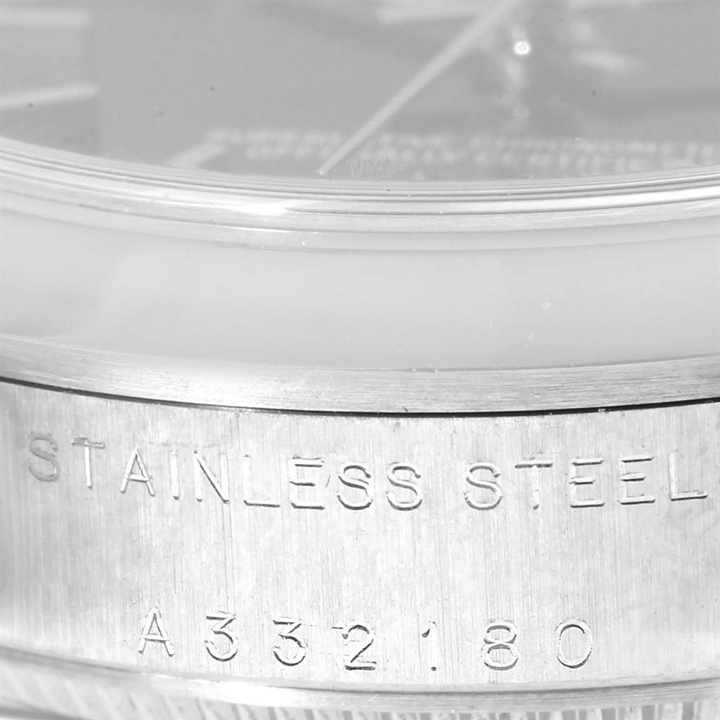 The close-up image shows the side of a Rolex Mid-Size 78240 Women's Stainless Steel Black Dial 78240 Women's Stainless Steel Black Dial watch, highlighting the stainless steel engraving and part of the serial number "A332180."