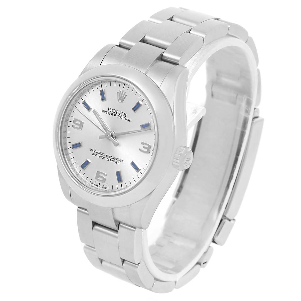 The image shows a Rolex Mid-Size 177200 Women's Stainless Steel Silver Dial 177200 Women's Stainless Steel Silver Dial Oyster Perpetual watch at a slight side angle, highlighting the dial, case, and bracelet.