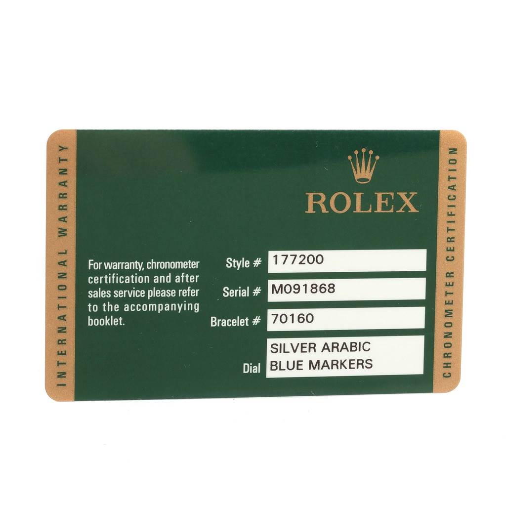 This image shows the warranty card for a mid-size Rolex watch, displaying style, serial, and bracelet numbers, along with dial details.