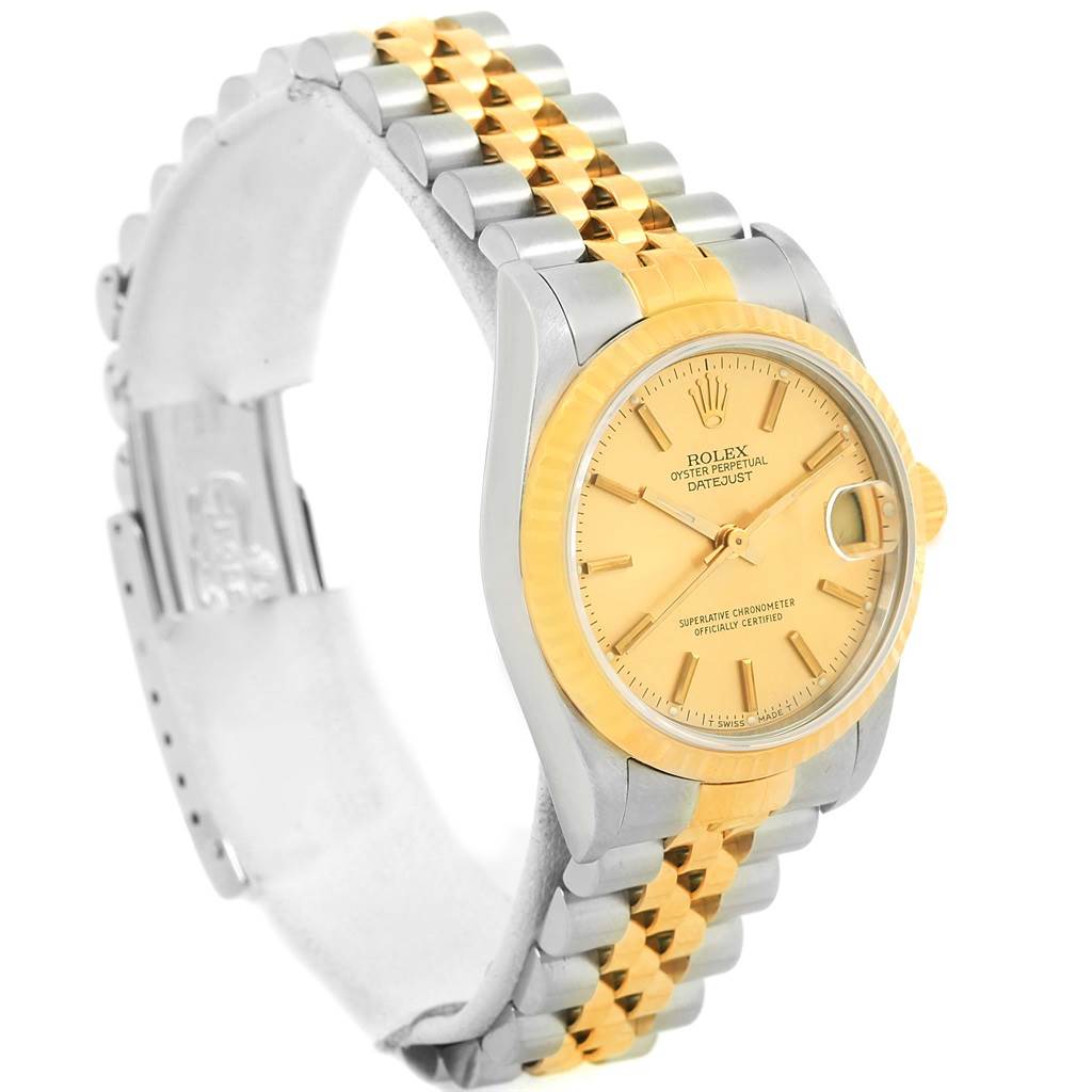 This Rolex Mid-Size 68273 Women's Steel and Gold (two tone) Champagne Dial 68273 Women's Steel and Gold (two tone) Champagne Dial Datejust watch is shown at a three-quarter angle, highlighting the face, bracelet, and clasp.