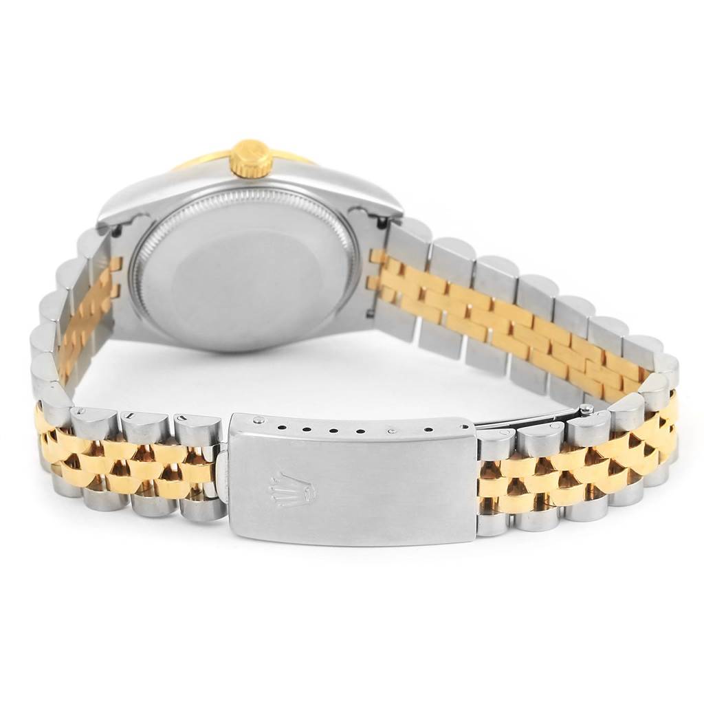 This image shows the back case, crown, and jubilee bracelet of a Mid-Size Rolex watch in silver and gold tones.