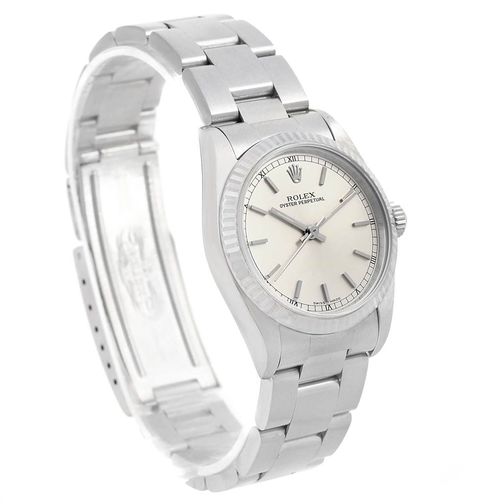 The image shows a side view of a Mid-Size Rolex Oyster Perpetual watch, detailing its bracelet, clasp, and dial.