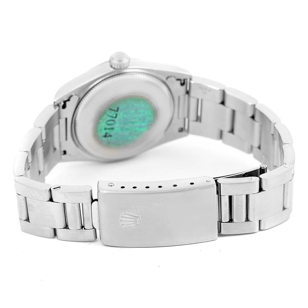 This image shows the back view of a Rolex Mid-Size 77014 Women's Stainless Steel Silver Dial 77014 Women's Stainless Steel Silver Dial model, featuring the case back and the bracelet clasp.