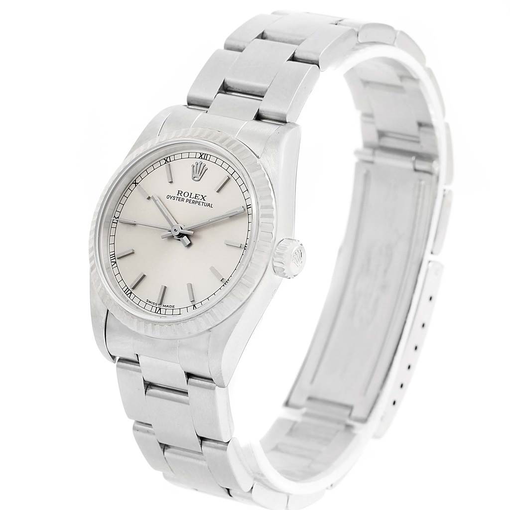 This image features a Rolex Mid-Size 77014 Women's Stainless Steel Silver Dial 77014 Women's Stainless Steel Silver Dial model watch shown at a slight angle, highlighting its face, bracelet, and side crown.