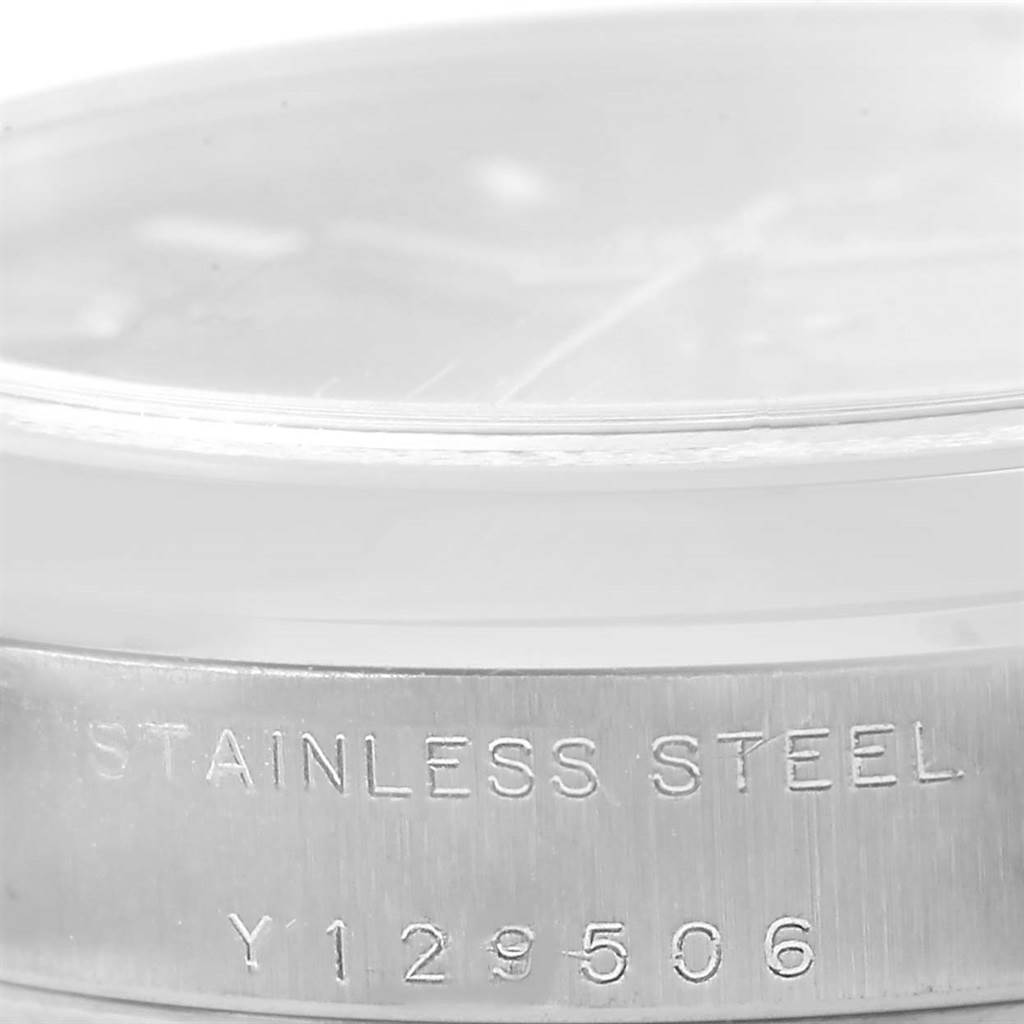 This image shows the side view of a stainless steel band with the inscription for the Mid-Size Rolex watch.