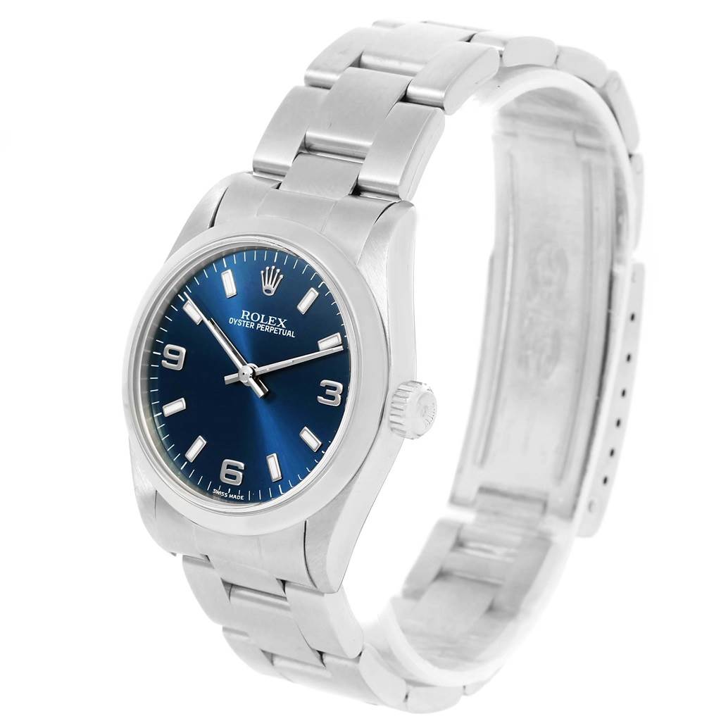 The Rolex Mid-Size 77080 Women's Stainless Steel Blue Dial 77080 Women's Stainless Steel Blue Dial model watch is shown at a slight angle, displaying the face, crown, and metal bracelet.