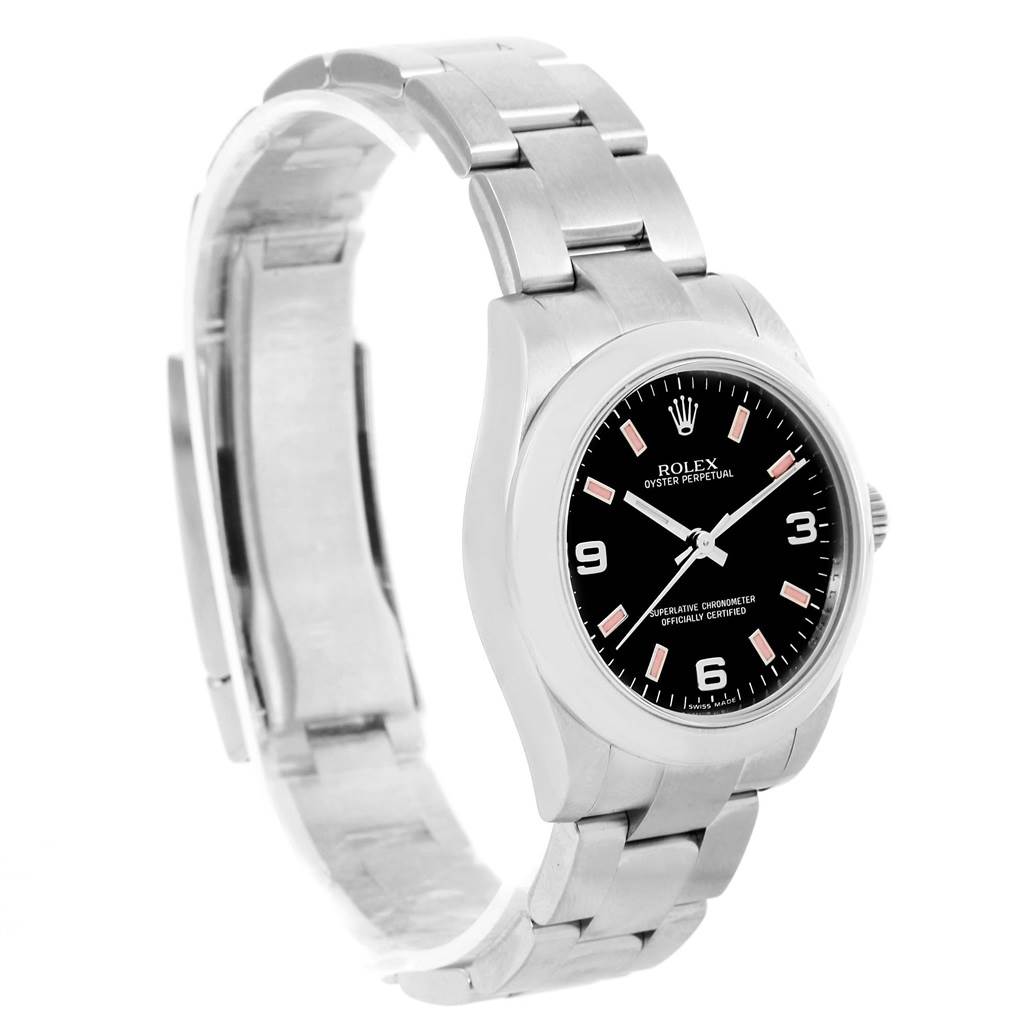 The image shows a side angle view of a Mid-Size Rolex Oyster Perpetual watch, highlighting its black dial and silver bracelet.