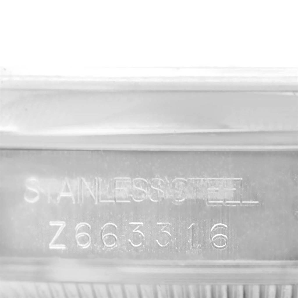 The image shows a close-up of the serial number and "Stainless Steel" engraving on a Rolex Mid-Size 178240 Women's Stainless Steel Grey Dial 178240 Women's Stainless Steel Grey Dial model watch.