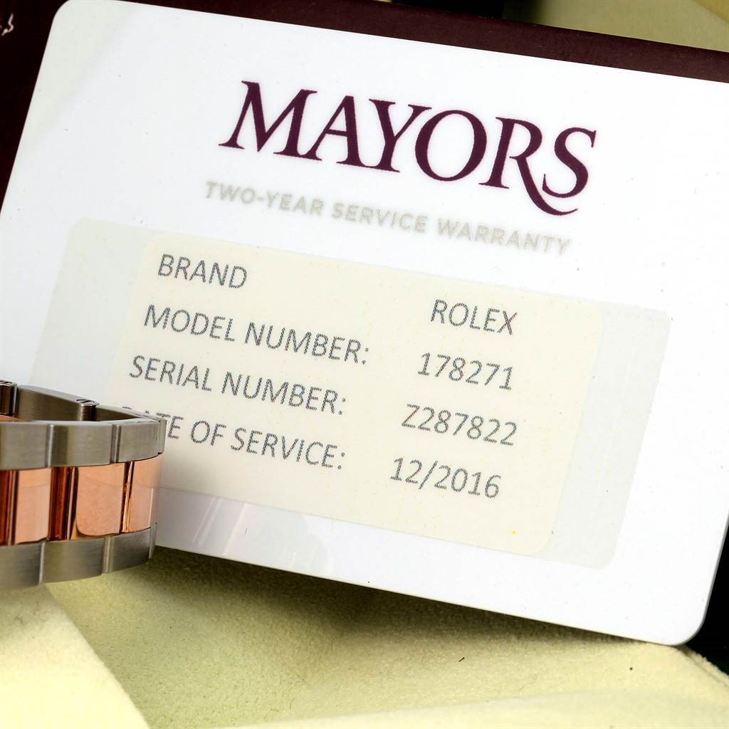 The image shows a partial view of the band of a Rolex Mid-Size 178271 Women's Steel and Gold (two tone) Pink Dial 178271 Women's Steel and Gold (two tone) Pink Dial watch, showcasing a two-tone metal link bracelet alongside a warranty card.