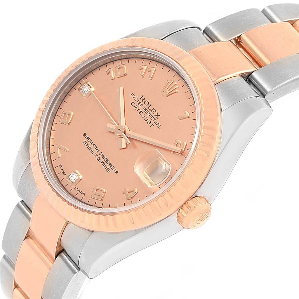 This Rolex Mid-Size 178271 Women's Steel and Gold (two tone) Pink Dial 178271 Women's Steel and Gold (two tone) Pink Dial Datejust watch is shown at a slight angle, highlighting the dial, bezel, and a portion of the bracelet.