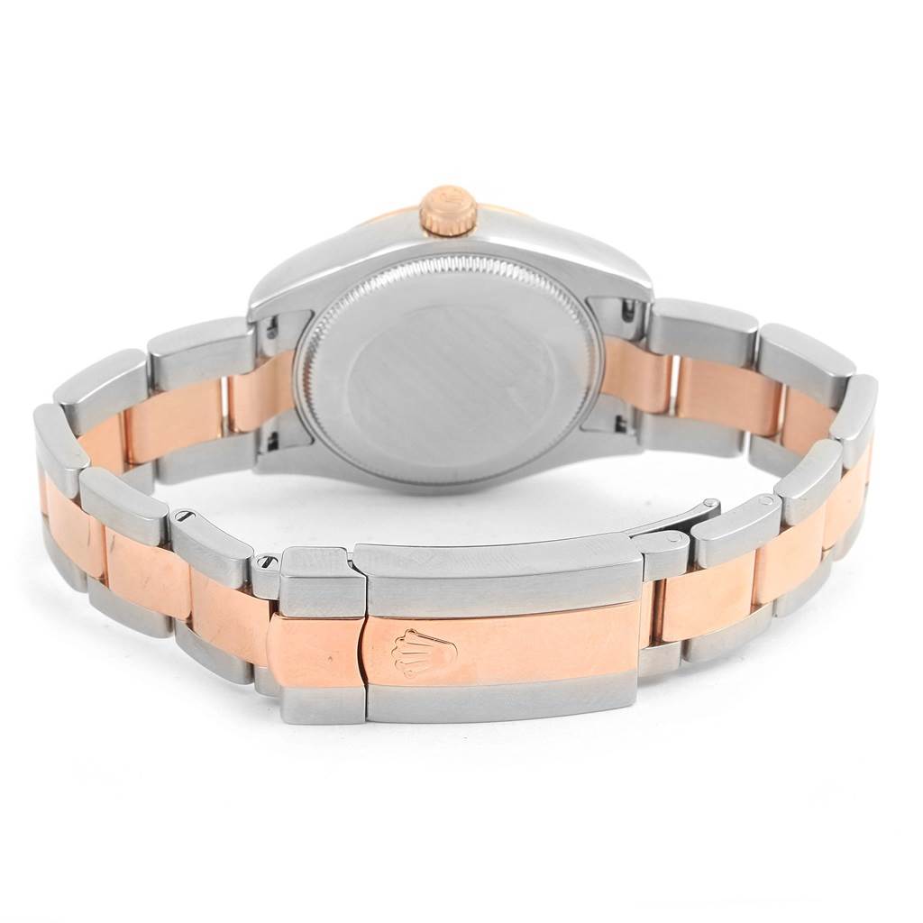 The image shows the back case and clasp of a Rolex Mid-Size 178271 Women's Steel and Gold (two tone) Pink Dial 178271 Women's Steel and Gold (two tone) Pink Dial watch, highlighting its two-tone metal bracelet.