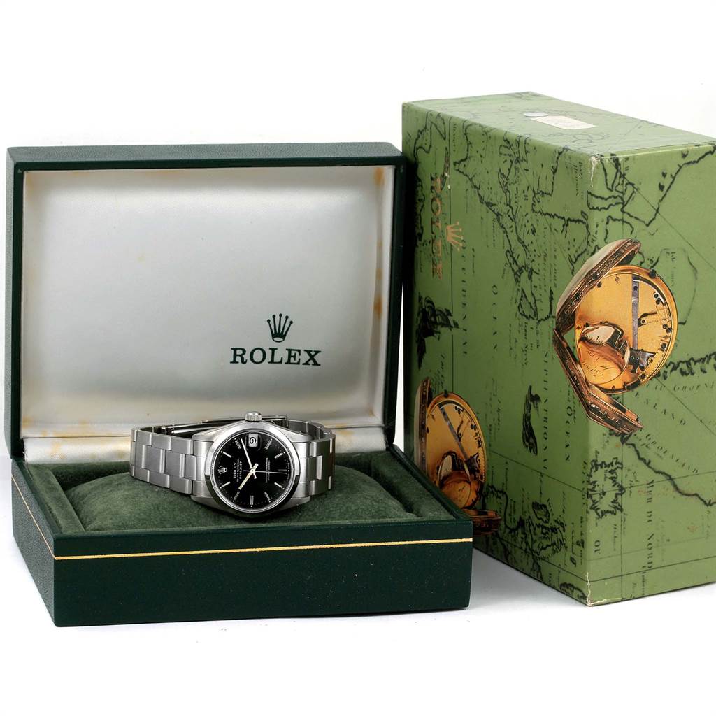 The image shows a Rolex Mid-Size 68240 Women's Stainless Steel Black Dial 68240 Women's Stainless Steel Black Dial model watch placed in an opened green box, alongside its outer packaging.
