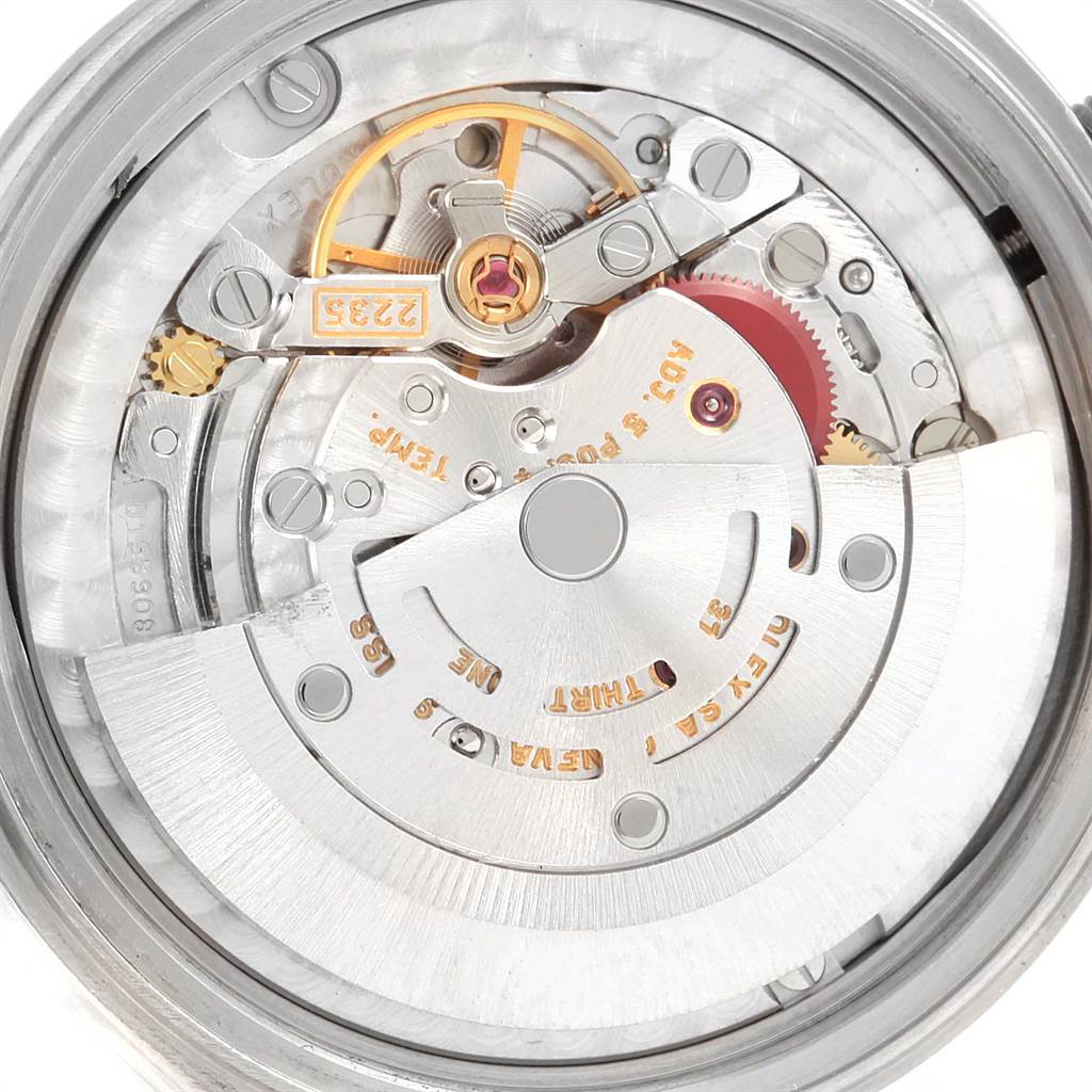 This image shows the internal movement mechanism of a Mid-Size Rolex watch from a top-down angle.