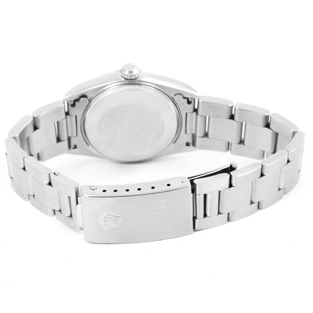 The image shows the back view of a Mid-Size Rolex watch, highlighting the case, bracelet, and clasp.