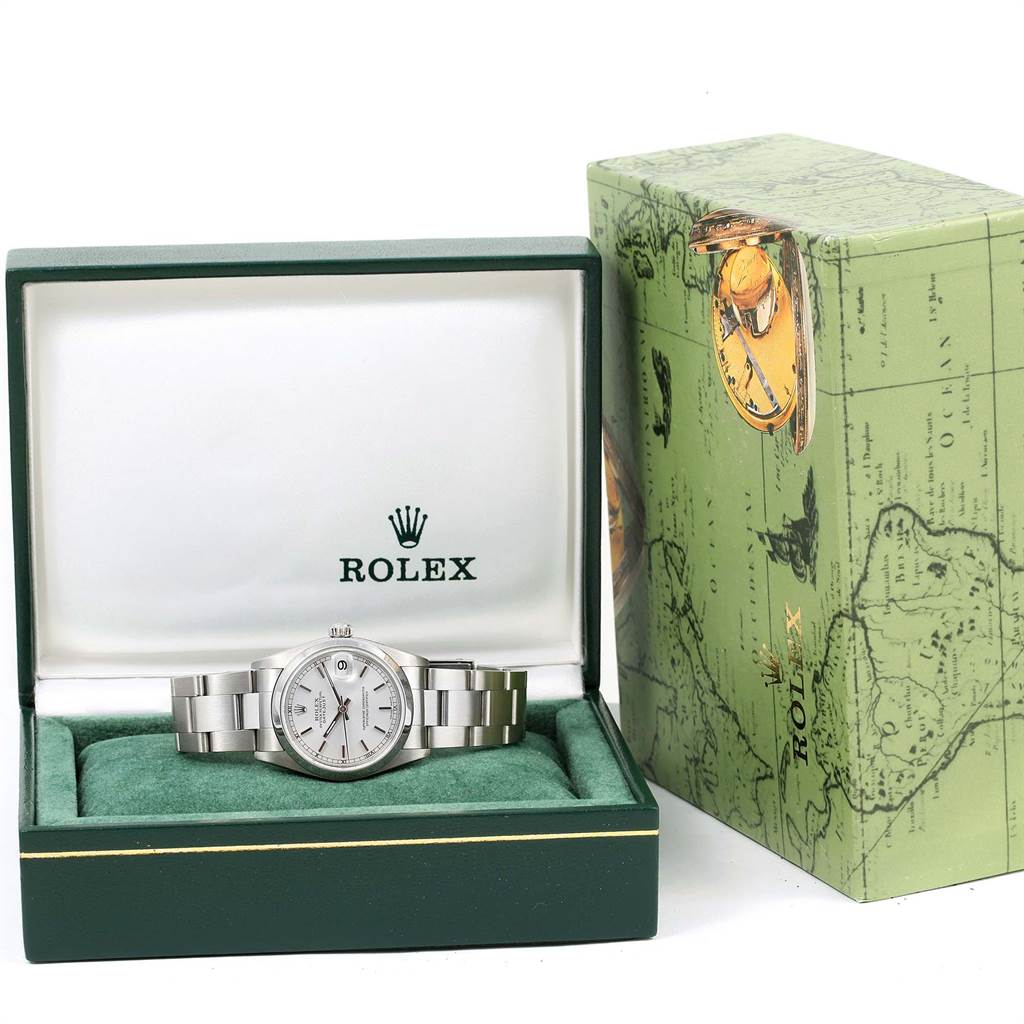 The Rolex Mid-Size 78240 Men's Stainless Steel Silver Dial 78240 Men's Stainless Steel Silver Dial watch is displayed front-facing in an open green box, with its outer packaging shown to the right.