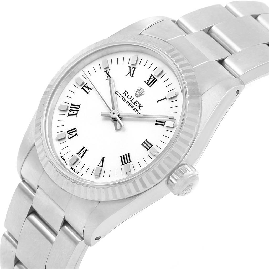 The image shows a side-angle view of a Rolex Mid-Size 67514 Women's Stainless Steel White Dial 67514 Women's Stainless Steel White Dial model watch, featuring its white dial, bezel, crown, and part of the bracelet.