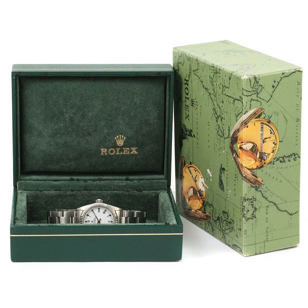 The Rolex Mid-Size 67514 Women's Stainless Steel White Dial 67514 Women's Stainless Steel White Dial model watch is shown in its opened box, with the outer box beside it.