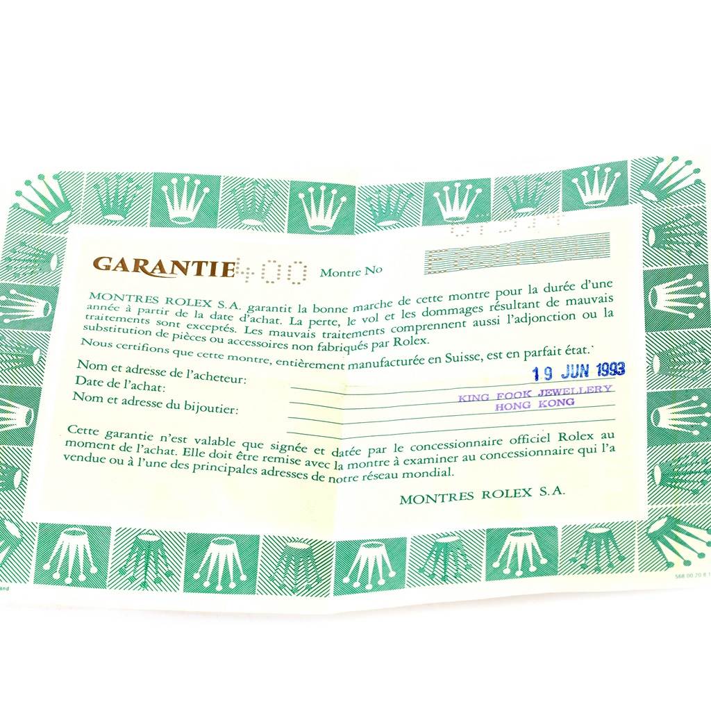 The image shows a warranty certificate for a Rolex Mid-Size 67514 Women's Stainless Steel White Dial 67514 Women's Stainless Steel White Dial watch, with text and logos visible.