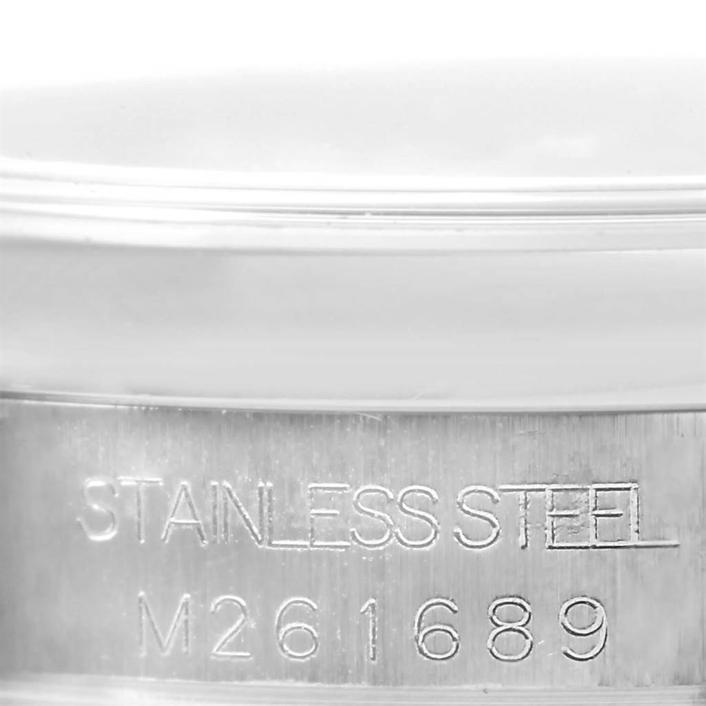 This image shows a close-up of the stainless steel case back with the serial number of a Rolex Mid-Size 178240 Women's Stainless Steel Black Dial 178240 Women's Stainless Steel Black Dial model watch.