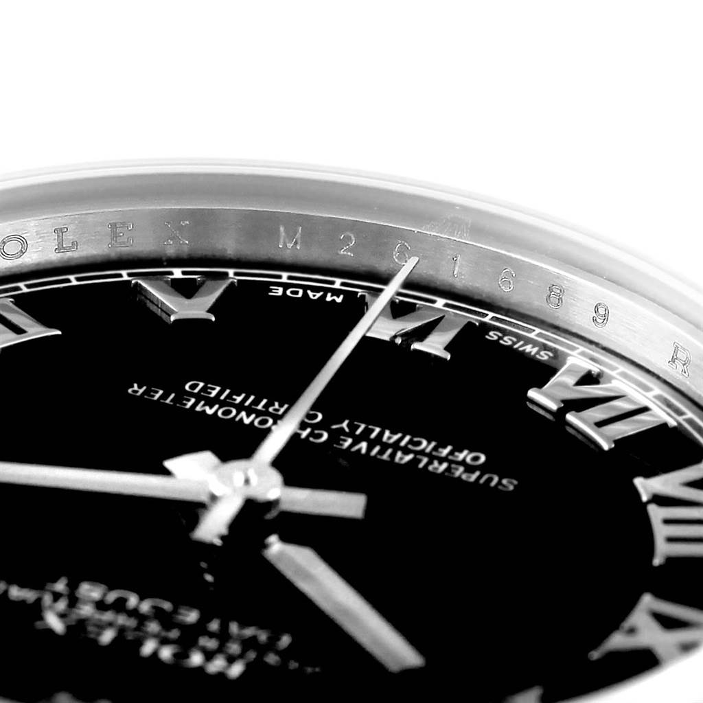 The image shows a close-up of the dial, hands, and part of the bezel of a Mid-Size Rolex watch.