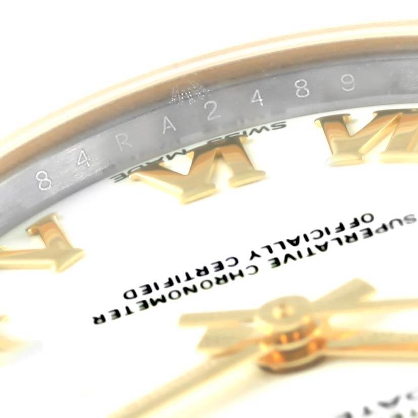 This is a close-up image of the dial and the inner bezel with a serial number of a Mid-Size Rolex watch.