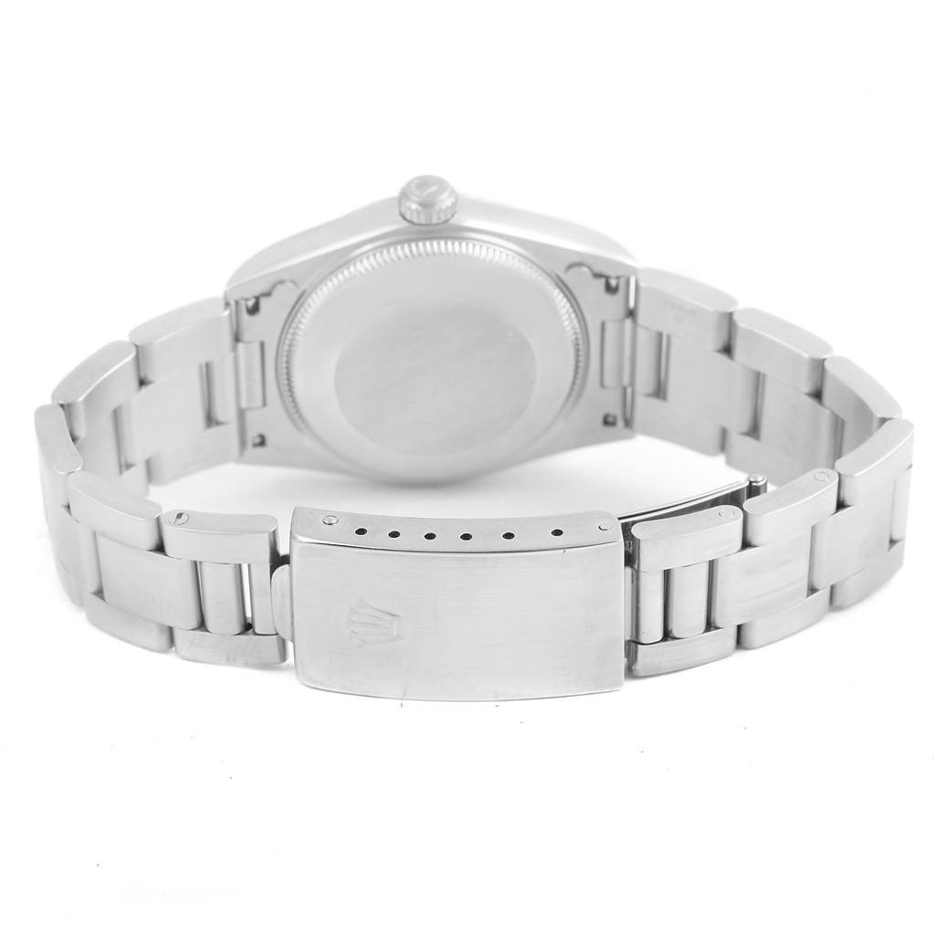 This image shows the rear view of a mid-size Rolex watch, highlighting the clasp, bracelet, and case back.