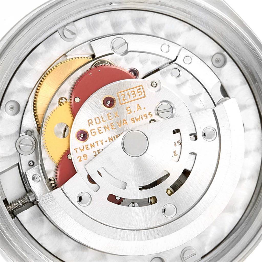 This image shows the internal mechanism and movement of a Mid-Size Rolex watch, viewed from the back.