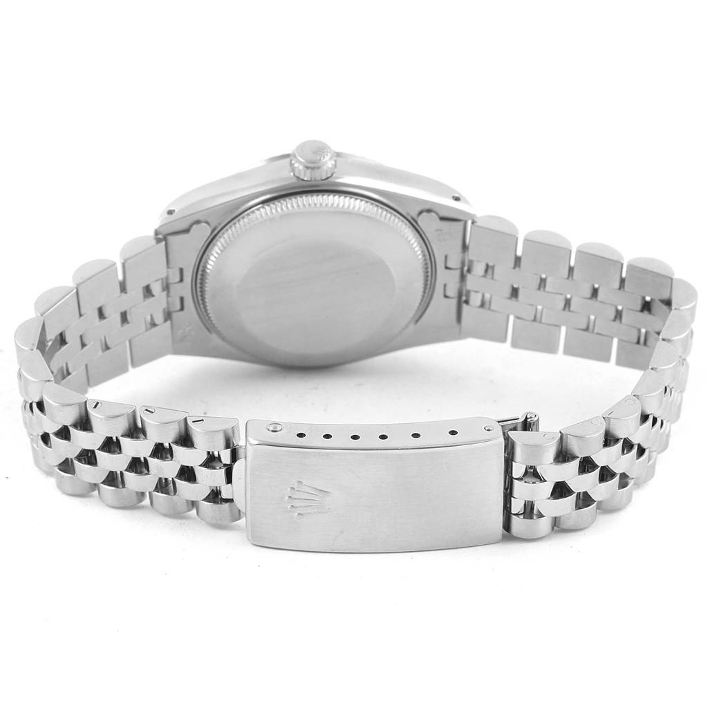 The image shows the back of a Rolex Mid-Size 68274 Women's Stainless Steel Silver Dial 68274 Women's Stainless Steel Silver Dial watch, highlighting the case back and the bracelet with the clasp.