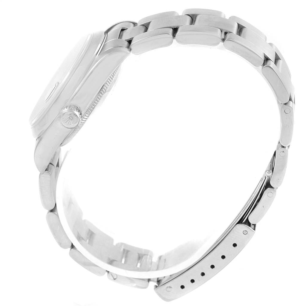 The image shows a side profile of a Rolex Mid-Size 68240 Women's Stainless Steel Black Dial 68240 Women's Stainless Steel Black Dial watch, highlighting the case, crown, and bracelet.