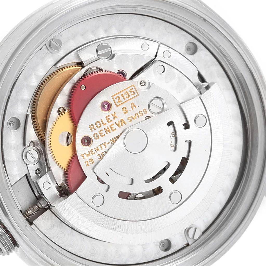 This image shows the internal mechanism of a Rolex Mid-Size 68240 Women's Stainless Steel Black Dial 68240 Women's Stainless Steel Black Dial model, focusing on the movement and gears.