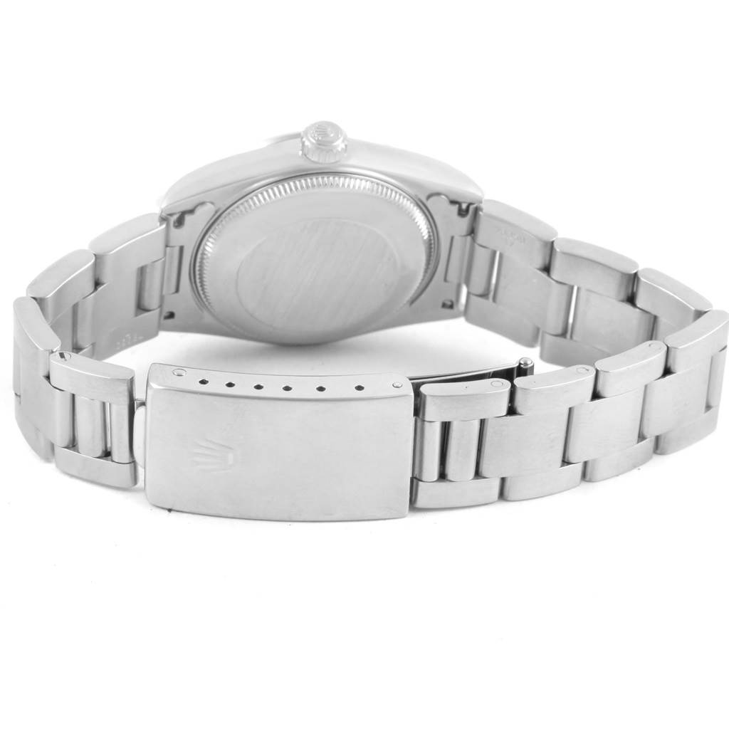 This image shows the back view of a Rolex Mid-Size 68240 Women's Stainless Steel Black Dial 68240 Women's Stainless Steel Black Dial watch, focusing on the clasp, bracelet, and case back.