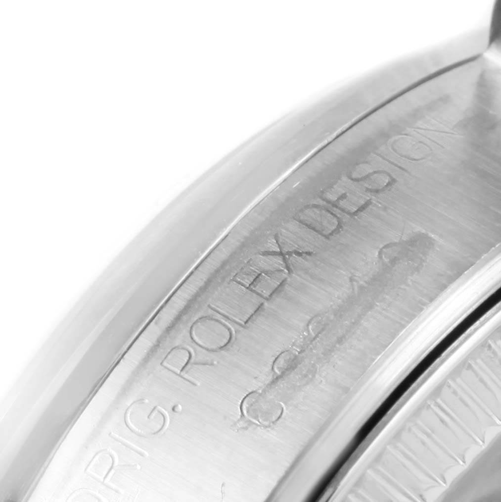 The image shows a close-up of the side of a Mid-Size Rolex watch, highlighting the etched "ORIG. ROLEX DESIGN" marking.
