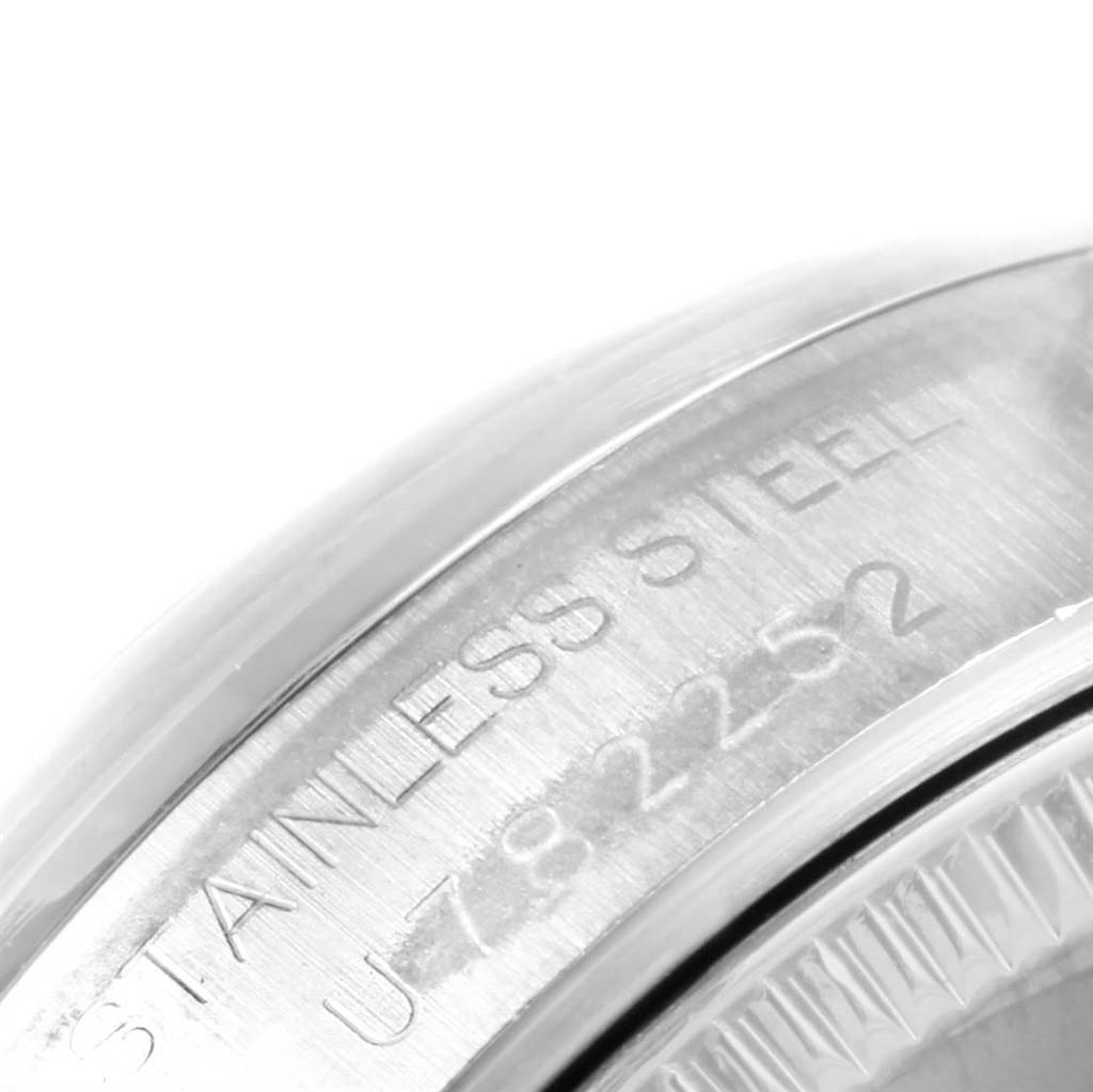 Close-up view of the engraved stainless steel case back of a Mid-Size Rolex watch.