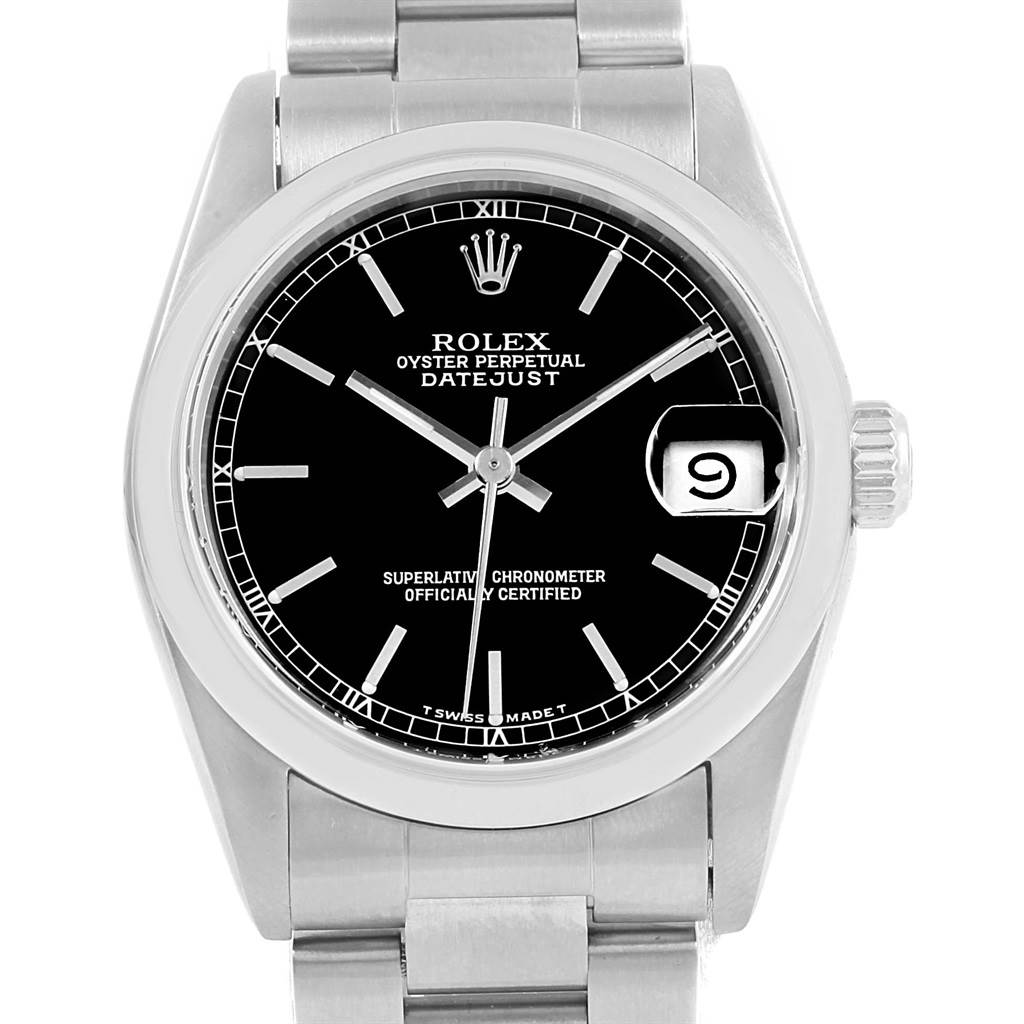 The image shows a front view of a Rolex Oyster Perpetual Datejust Mid-Size model, highlighting the black dial, date window, and stainless steel bracelet.