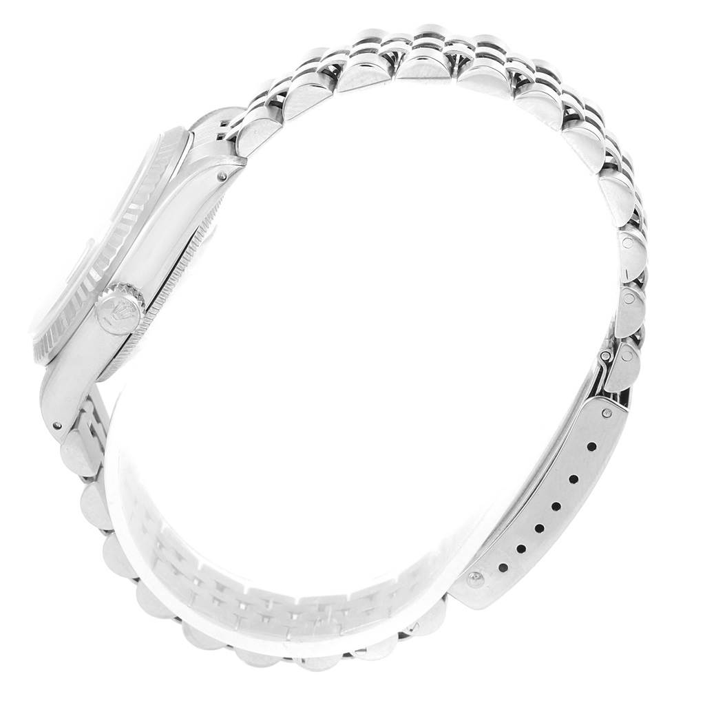 The image shows a side view of the Rolex Mid-Size 68274 Women's Stainless Steel Silver Dial 68274 Women's Stainless Steel Silver Dial watch, highlighting the crown, bezel, and bracelet links.