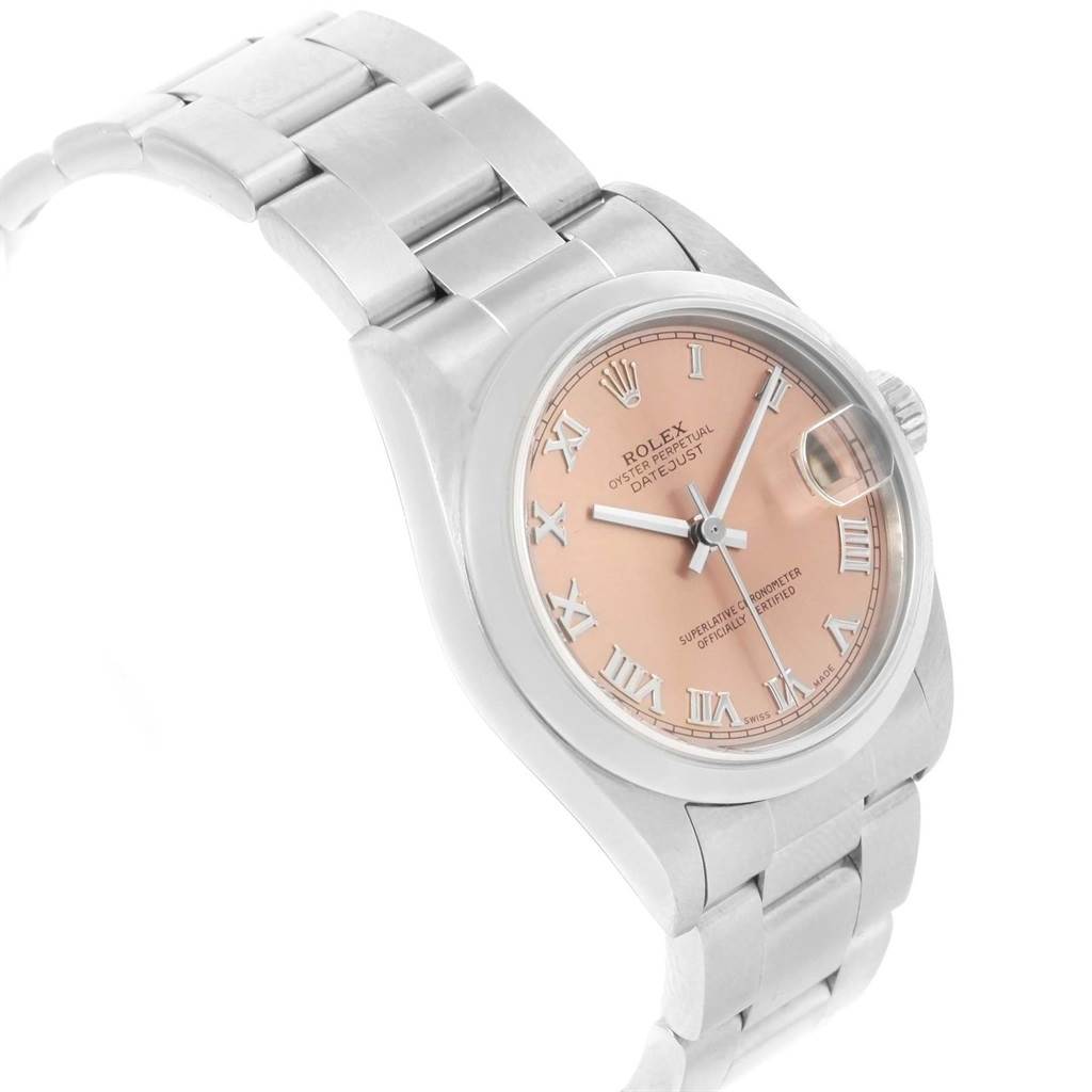The image shows a side angle of a Rolex Mid-Size 78240 Women's Stainless Steel Pink Dial 78240 Women's Stainless Steel Pink Dial model watch, highlighting its pink dial, Roman numerals, and stainless steel bracelet.