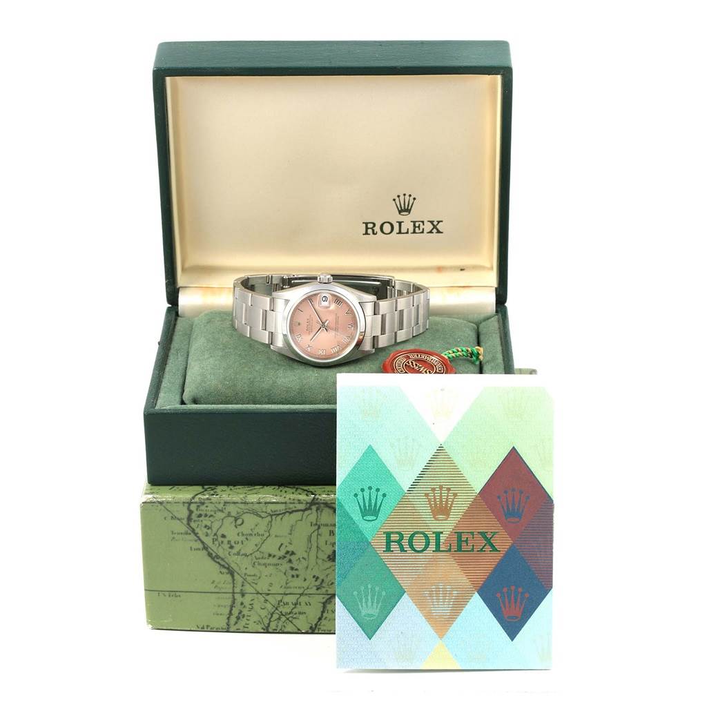 The Rolex Mid-Size 78240 Women's Stainless Steel Pink Dial 78240 Women's Stainless Steel Pink Dial model watch is displayed in its green box along with its warranty card and accessory tag.
