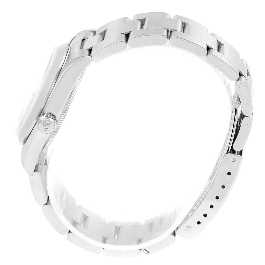 The image shows a side view of a Rolex Mid-Size 68240 Women's Stainless Steel Silver Dial 68240 Women's Stainless Steel Silver Dial watch, highlighting the case, bezel, crown, and the bracelet with its adjustable clasp.