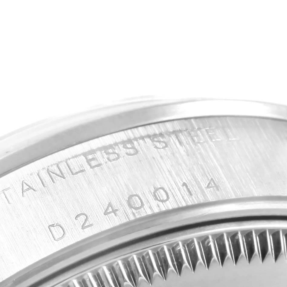 This close-up shows the side inscription and part of the bezel of the Rolex Mid-Size 68240 Women's Stainless Steel Silver Dial 68240 Women's Stainless Steel Silver Dial model watch.