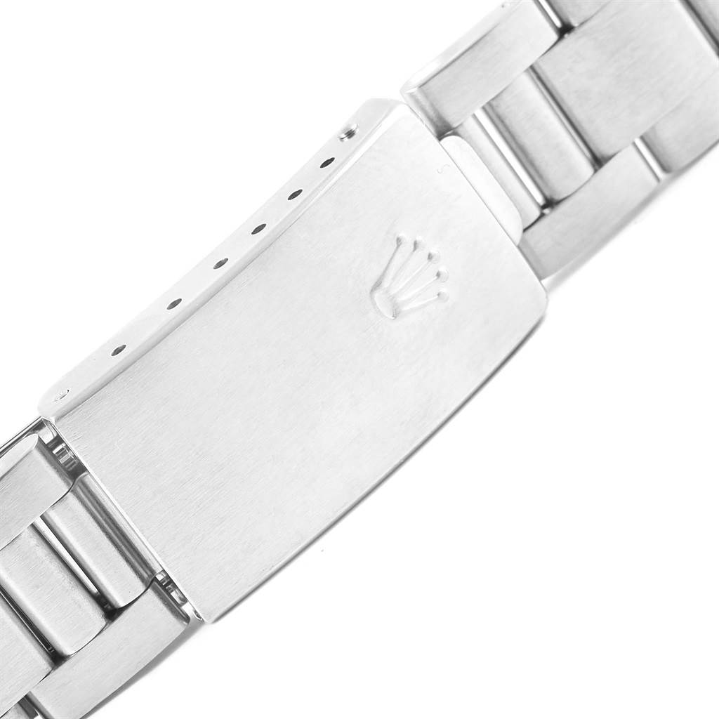 The image shows the clasp and part of the bracelet of the Mid-Size Rolex watch.