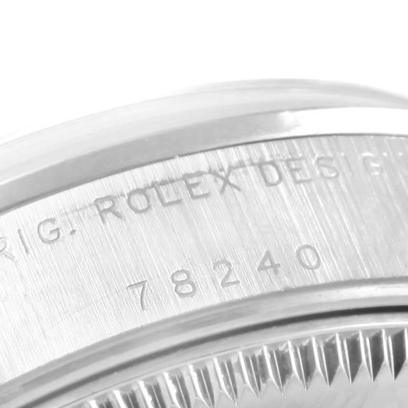 The image shows a close-up of the engraved side of a Rolex Mid-Size 68240 Women's Stainless Steel Silver Dial 68240 Women's Stainless Steel Silver Dial model, displaying part of the bezel and case with model number 78240.