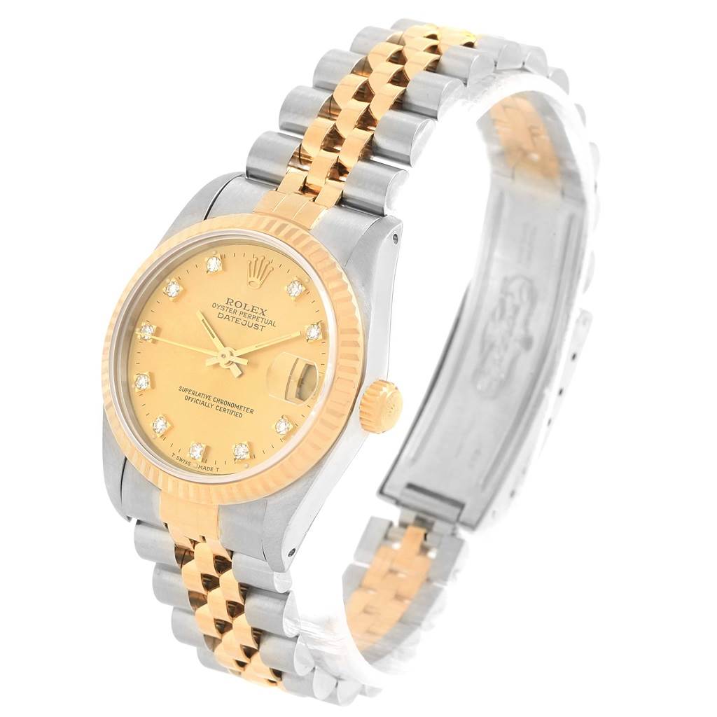 The image shows a Rolex Mid-Size 68273 Women's Steel and Gold (two tone) Champagne Dial 68273 Women's Steel and Gold (two tone) Champagne Dial Datejust watch from a tilted angle, highlighting the face, bezel, and two-tone bracelet.