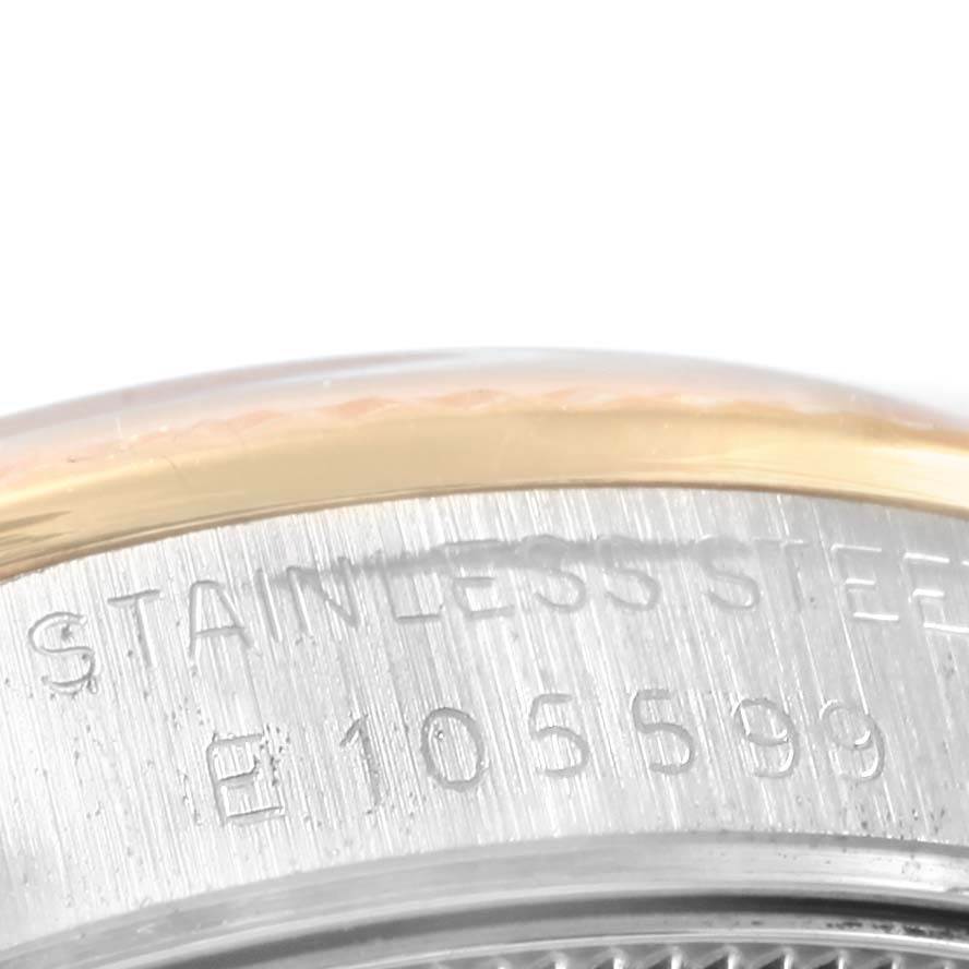 The image shows a close-up view of the serial number and stainless steel marking on a Rolex Mid-Size 68273 Women's Steel and Gold (two tone) Champagne Dial 68273 Women's Steel and Gold (two tone) Champagne Dial watch case.