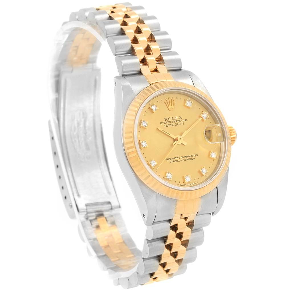 The Rolex Mid-Size 68273 Women's Steel and Gold (two tone) Champagne Dial 68273 Women's Steel and Gold (two tone) Champagne Dial Datejust model is shown from an oblique angle, highlighting the dial, bezel, crown, and two-tone bracelet.