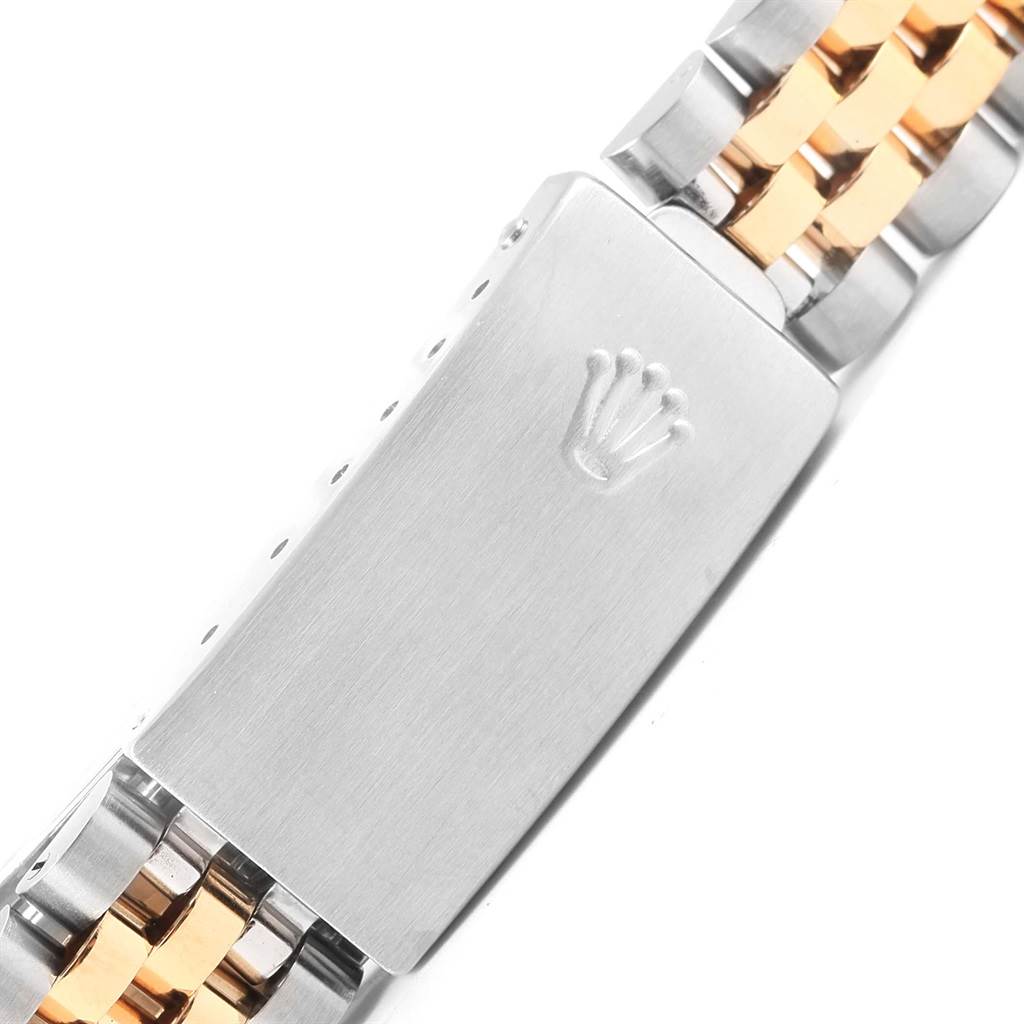 The image shows a close-up of a mid-size Rolex watch bracelet clasp.