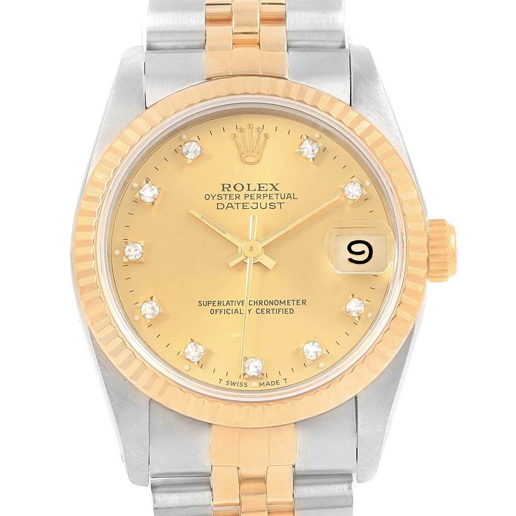 The image shows a front view of a Rolex Mid-Size 68273 Women's Steel and Gold (two tone) Champagne Dial 68273 Women's Steel and Gold (two tone) Champagne Dial Oyster Perpetual Datejust watch displaying its dial, bezel, and part of its bracelet.