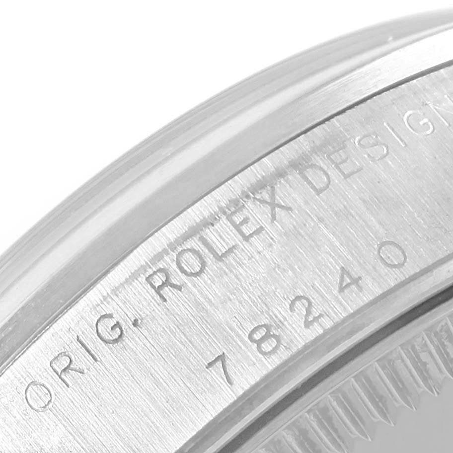 The close-up image shows the serial and model number engraving on the side of a Rolex Mid-Size 78240 Women's Stainless Steel Silver Dial 78240 Women's Stainless Steel Silver Dial watch case.