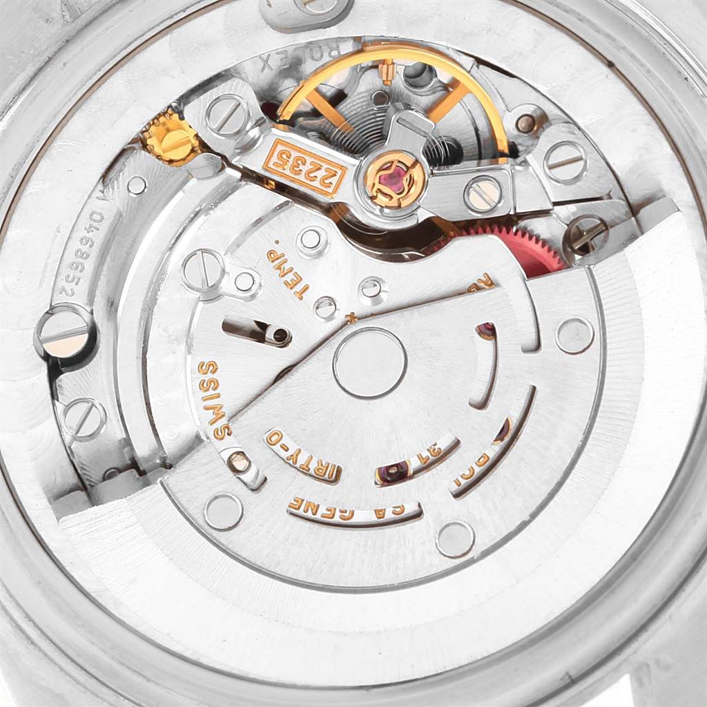 The image shows a close-up of the internal movement mechanism of a Mid-Size Rolex watch.